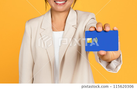 Glad young asian woman in suit shows credit card, recommend profit, savings isolated on yellow studio background, close up. Sale, finance for shopping, ad and offer, pay and buy Glad young asian woman in suit shows credit card, recommend profit, savings isolated on yellow studio background, close up. Sale, finance for shopping, ad and offer, pay and buy 115620306