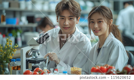 Scientists, colleagues Asian man woman work laboratory under microscopes, study research food Scientists, colleagues Asian man woman work laboratory under microscopes, study research food 115620652