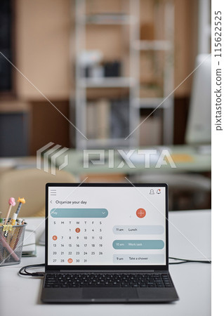 Vertical shot of online calendar page on laptop screen for schedule planning. Personal and business organizer, copy space Vertical shot of online calendar page on laptop screen for schedule planning. Personal and business organizer, copy space 115622525