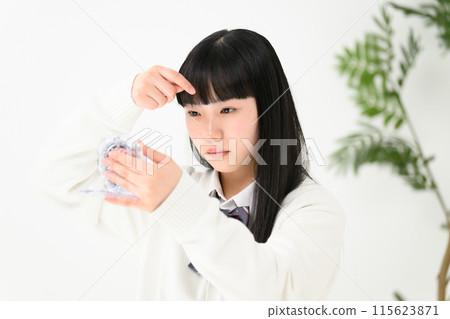 High school girl worried about her bangs High school girl worried about her bangs 115623871