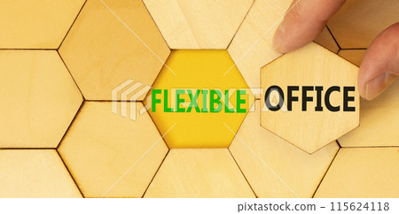 Flexible office symbol. Concept words Flexible office on beautiful wooden puzzles. Beautiful yellow background. Businessman hand. Business Flexible office concept. Copy space. 115624118