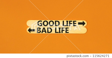 Good or bad life symbol. Concept word Good life Bad life on beautiful wooden stick. Beautiful orange table orange background. Business and Good or bad life concept. Copy space. 115624271