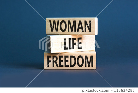 Woman life freedom symbol. Concept words Woman Life Freedom on wooden blocks on a beautiful grey table grey background. Social issue woman life freedom concept. Copy space. Woman life freedom symbol. Concept words Woman Life Freedom on wooden blocks on a beautiful grey table grey background. Social issue woman life freedom concept. Copy space. 115624295