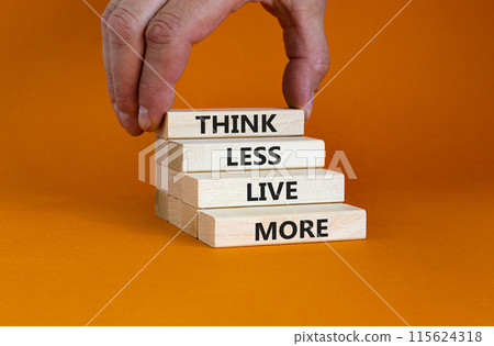 Think less live more symbol. Blocks with concept words Think less live more on a beautiful orange background. businessman hand. Business, psychological and think less live more concept. Copy space. Think less live more symbol. Blocks with concept words Think less live more on a beautiful orange background. businessman hand. Business, psychological and think less live more concept. Copy space. 115624318