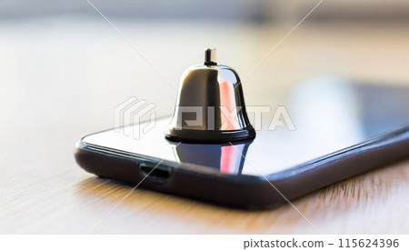 Notification message bell alert and alarm on blurred desk with close up smartphone reminder. 115624396