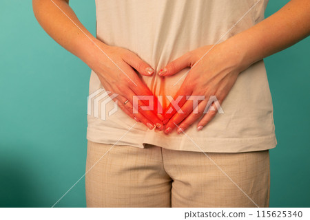 Menstrual pain, woman with stomachache suffering from pms , endometriosis, cystitis and other diseases of the urinary system, painful area highlighted in red 115625340