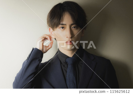 Man in black suit 115625612