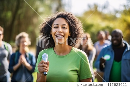 Woman Leading Community Event with Microphone Woman Leading Community Event with Microphone 115625621