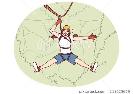 Woman tourist hangs on zip line over forest cliff enjoying extreme vacation in picturesque place 115625669