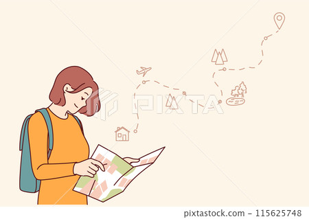 Woman tourist uses paper map to travel through nature reserves and plot route to destination 115625748
