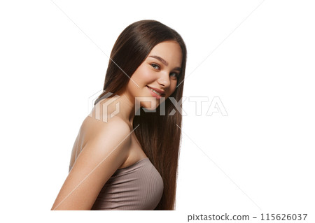 Portrait of smiling young woman with well-kept, smooth skin and perfect shiny hair isolated on white background Portrait of smiling young woman with well-kept, smooth skin and perfect shiny hair isolated on white background 115626037