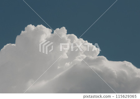 white thunderclouds in blue sky. summer cumulus clouds before rain. Beautiful view of nature 115629365