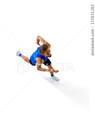 Isometric view of competitive and athletic young man, runner in motion, training, running isolated on white studio background 115631162