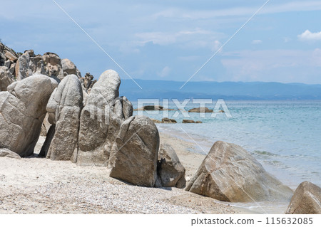 Big rock on the beach shore 115632085