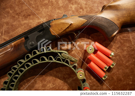 Closeup rifle and bullets with belt chain for hunting hobby 115632287