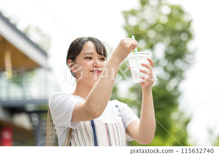 Young and cute Japanese woman drinking water outdoors | Heat stroke prevention | Hydration 115632740
