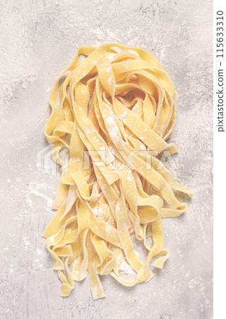 raw tagliatelli pasta , homemade, top view, no people, rustic, food concept, raw tagliatelli pasta , homemade, top view, no people, rustic, food concept, 115633310