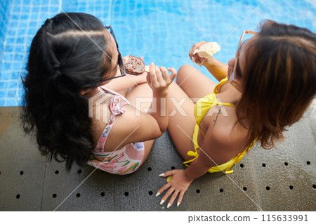 Mother and Daughter Eating Icecreams 115633991