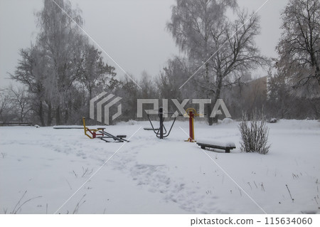 a Playground on a foggy winter day a Playground on a foggy winter day 115634060