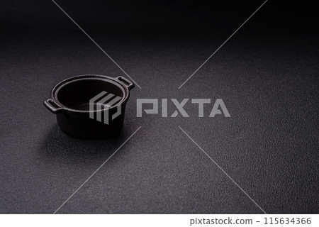 Beautiful empty white ceramic gravy boat on a concrete background Beautiful empty white ceramic gravy boat on a concrete background 115634366
