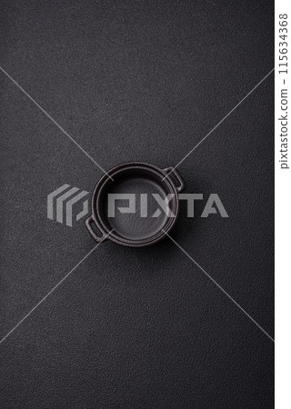 Beautiful empty white ceramic gravy boat on a concrete background Beautiful empty white ceramic gravy boat on a concrete background 115634368