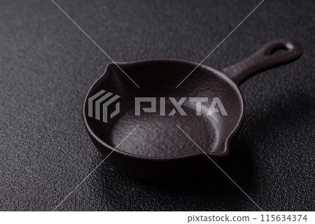 Beautiful empty white ceramic gravy boat on a concrete background Beautiful empty white ceramic gravy boat on a concrete background 115634374