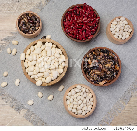 Raw white and red beans in a plate on the table, top view. 115634500