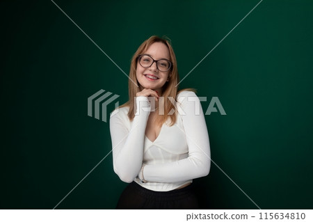 Woman in White Shirt and Black Skirt Posing for Picture 115634810