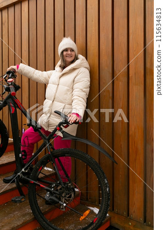Woman Standing Next to Bike on Staircase 115634813