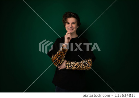 Woman Standing in Front of Green Wall 115634815