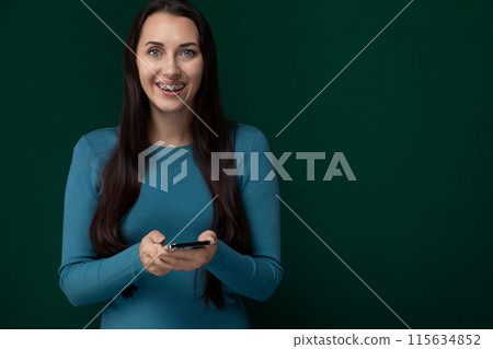 Woman Holding Cell Phone in Hands Woman Holding Cell Phone in Hands 115634852