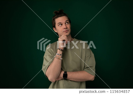 Thoughtful Man Standing With Hand on Chin 115634857