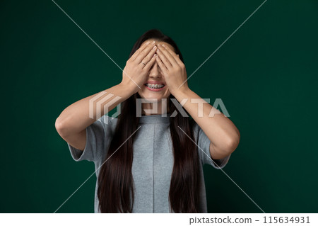 Woman Covering Eyes With Hands 115634931