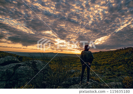 Human silhouette at sunset Human silhouette at sunset 115635180