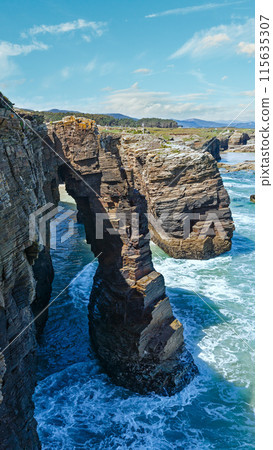 Natural arches on beach. Natural arches on beach. 115635307