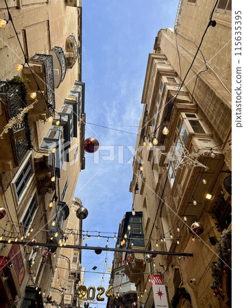 Street view of old town in Valletta, Malta, Europe. Christmas decorations on the streets  115635395