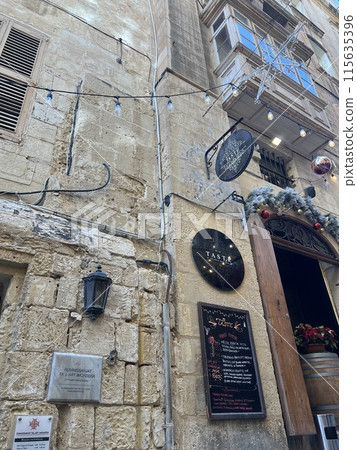 Street view of old town in Valletta, Malta, Europe. Christmas decorations on the streets Street view of old town in Valletta, Malta, Europe. Christmas decorations on the streets 115635396