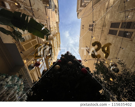 Street view of old town in Valletta, Malta, Europe. Christmas decorations on the streets  115635402