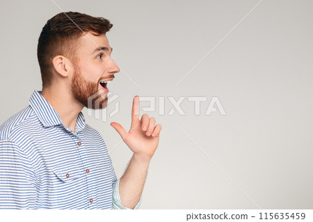 Young excited man having good idea and feeling happy about that, panorana, copy space Young excited man having good idea and feeling happy about that, panorana, copy space 115635459