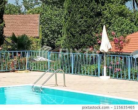 empty outdoor swimming pool in summer empty outdoor swimming pool in summer 115635465