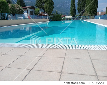 empty outdoor swimming pool in summer 115635551