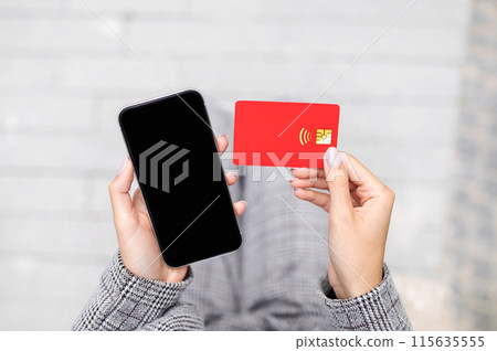 Cashback for Business. Closeup Of Credit Card And Smartphone With Empty Black Screen In Businesswoman Hands Outdoor, Top View. Lady Paying Shopping Online In Phone Application. Mobile Banking 115635555
