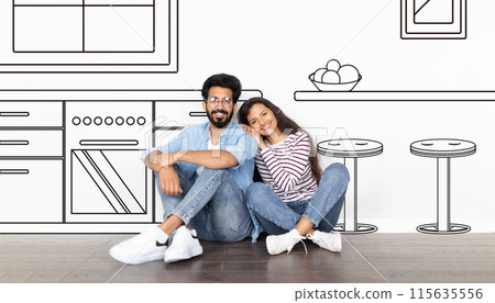 Happy young indian couple enjoy dreams of own house, buy new home, design, in kitchen interior with drawn furniture, isolated on white studio background. Rent apartment, moving 115635556