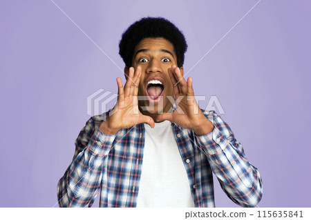 Attention. Guy shouting, holding hands near open mouth on pink studio background 115635841