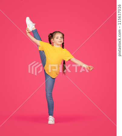 Sporty little girl making gymnastic exercises, flexible preteen female child raising her leg in twine and looking at camera, doing stretching and posing over pink studio background, full length Sporty little girl making gymnastic exercises, flexible preteen female child raising her leg in twine and looking at camera, doing stretching and posing over pink studio background, full length 115637016