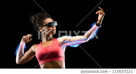 Sports technology concept. Motivated young african american woman bodybuilder posing over black studio background, using virtual reality headset while exercising, practicing marital arts, panorama 115637221
