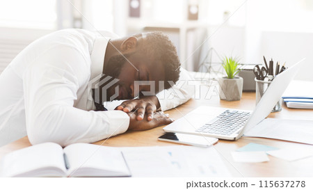 Exhausted african american young employee sleeping in his office, stress and tiredness concept, panorama with copy space 115637278