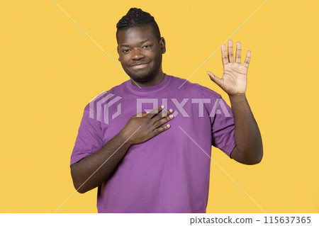 I Swear. Honest Black Man Doing Oath Gesture Posing In Purple T Shirt, Looking At Camera Standing Over Yellow Background In Studio. Guy Presses Hand to Chest and Swears. Gratitude, Promise Concept I Swear. Honest Black Man Doing Oath Gesture Posing In Purple T Shirt, Looking At Camera Standing Over Yellow Background In Studio. Guy Presses Hand to Chest and Swears. Gratitude, Promise Concept 115637365