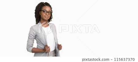 Confident African American businesswoman wearing a grey blazer and glasses, isolated on a white background, panorama with copy space Confident African American businesswoman wearing a grey blazer and glasses, isolated on a white background, panorama with copy space 115637370