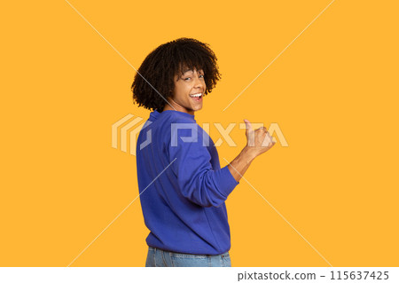 A man wearing a blue shirt and jeans stands in the image, enthusiastically giving a thumbs up gesture. His casual attire and positive expression convey a sense of approval and happiness. A man wearing a blue shirt and jeans stands in the image, enthusiastically giving a thumbs up gesture. His casual attire and positive expression convey a sense of approval and happiness. 115637425